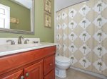 Guest Bathroom with Shower/Tub Combo at 220 Evian